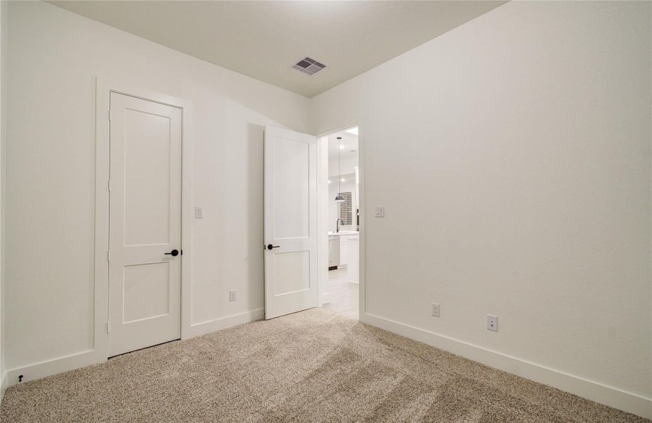 Second secondary room down hallway off of the kitchen area!