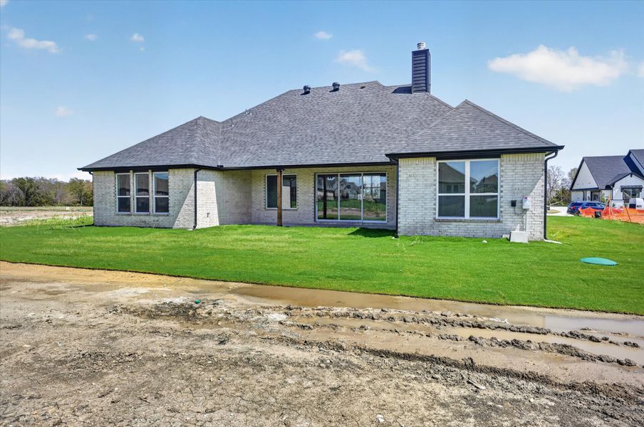 Exterior details and patio area of a home in Paloma Ranches, Justin (Image 4).