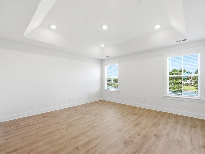 Spacious, unfurnished interior of a new home in The Coves at Lakes of Cane Bay II, Summerville (Image 15).