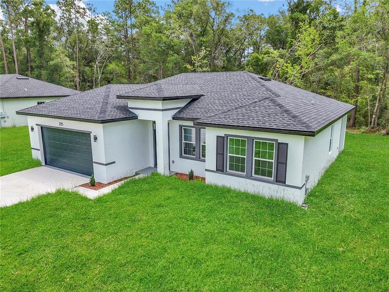 Front exterior of a new home in , Dunnellon, FL, highlighting curb appeal (Image 21).