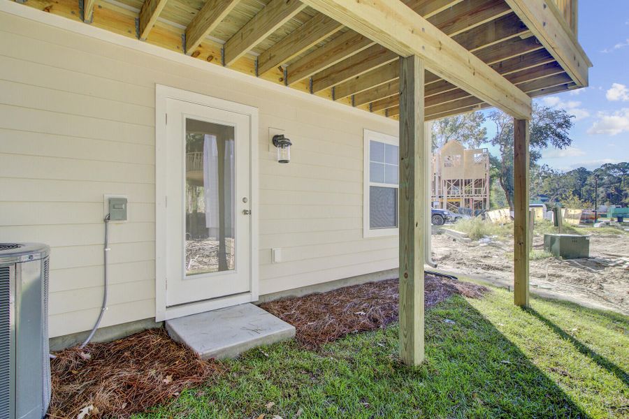 Exterior details and patio area of a home in Indigo Grove Townhomes, Johns Island (Image 26).