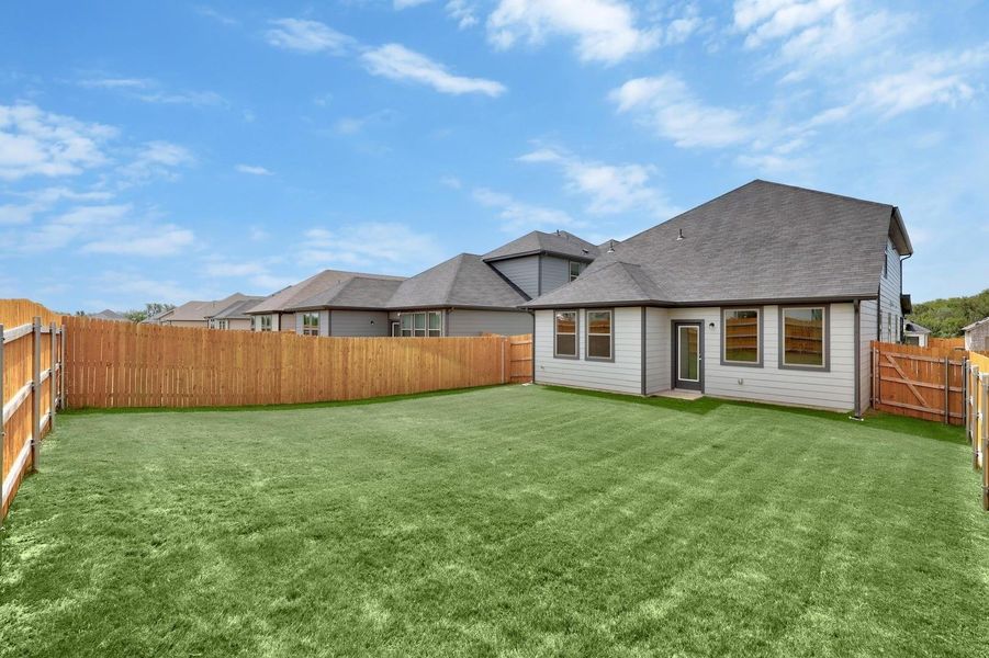 Exterior details and patio area of a home in Trinity Ranch, Elgin (Image 3). Exterior details and patio area of a home in Trinity Ranch, Elgin (Image 3).