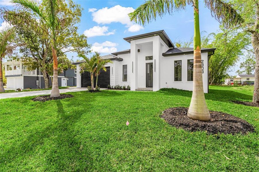 Front exterior of a new home in , Lehigh Acres, FL, highlighting curb appeal (Image 22).