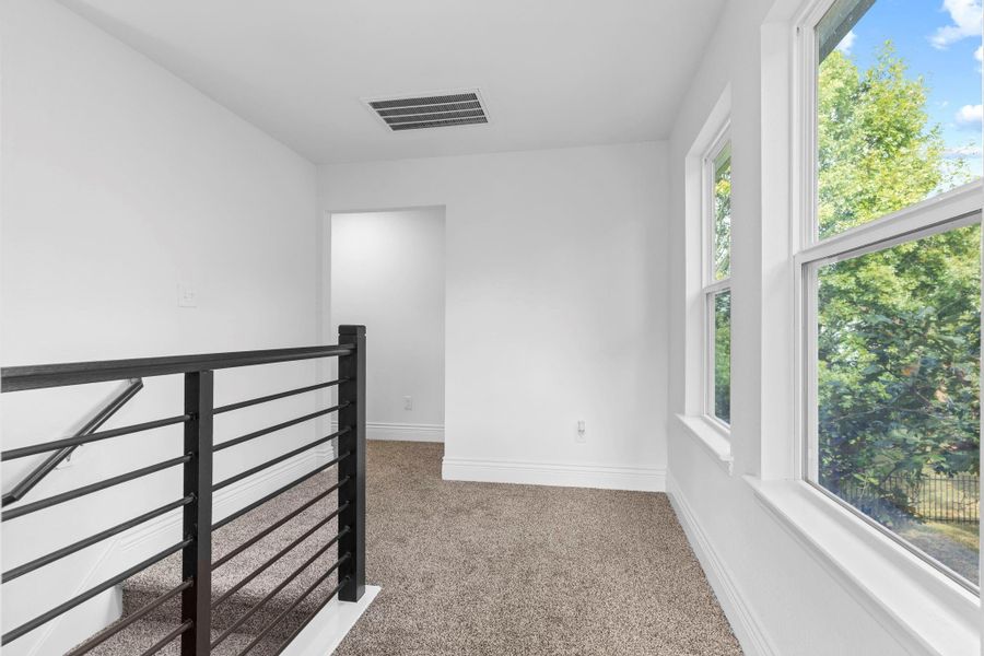 This upper landing feels bright and cheerful with large windows that bring in the prettiest outdoor views. It creates a peaceful space as you move between the upstairs rooms. This upper landing feels bright and cheerful with large windows that bring in the prettiest outdoor views. It creates a peaceful space as you move between the upstairs rooms.