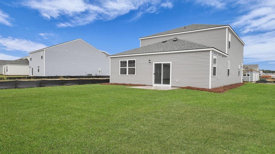 Exterior details and patio area of a home in Pine Hills at Cane Bay, Summerville (Image 3).