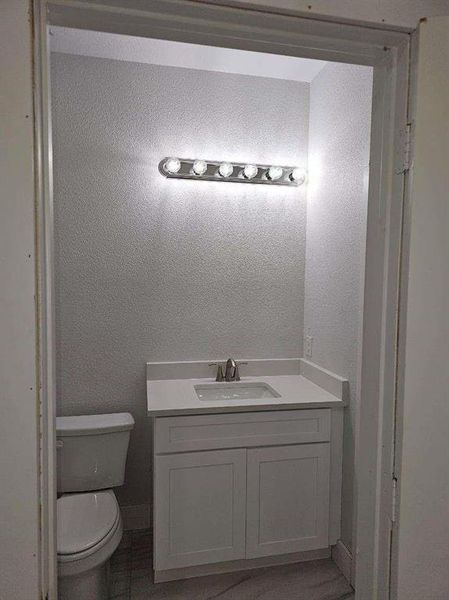 Bathroom featuring toilet and vanity