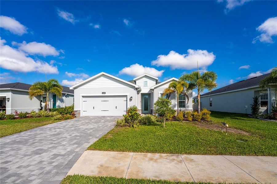 Front exterior of a new home in , Port Charlotte, FL, highlighting curb appeal (Image 20).