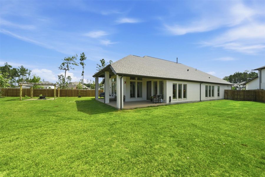 Exterior details and patio area of a home in Artavia, Conroe (Image 27).
