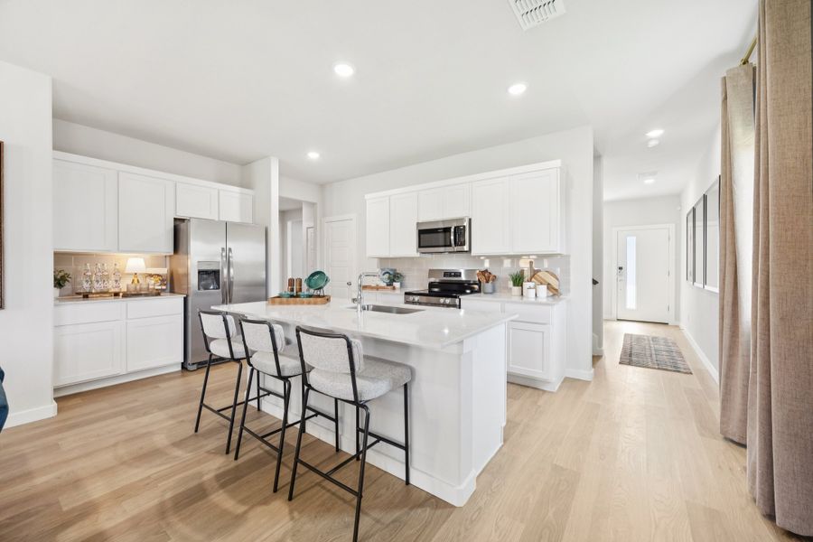 Kitchen in a Belmont Magnolia Model Home in Aubrey TX by Trophy Signature Homes