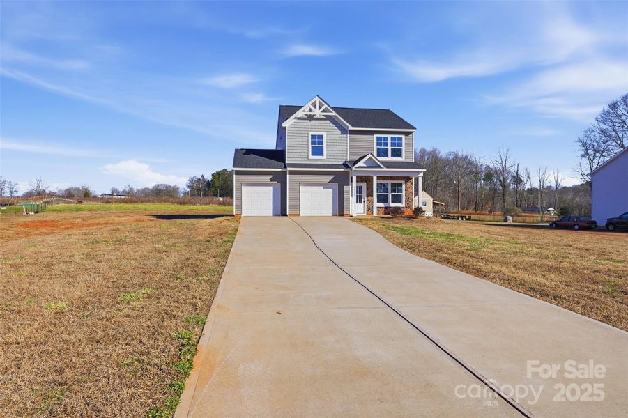 Front exterior of a new home in , Lincolnton, NC, highlighting curb appeal (Image 15).