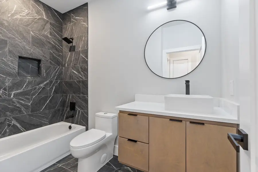 Full bathroom featuring vanity and bathing tub / shower combination
