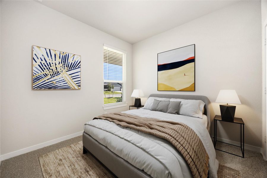This comfortable secondary bedroom offers soft neutral tones, plush carpeting, and a bright window that fills the space with natural light, perfect for guests, a home office, or a cozy retreat.