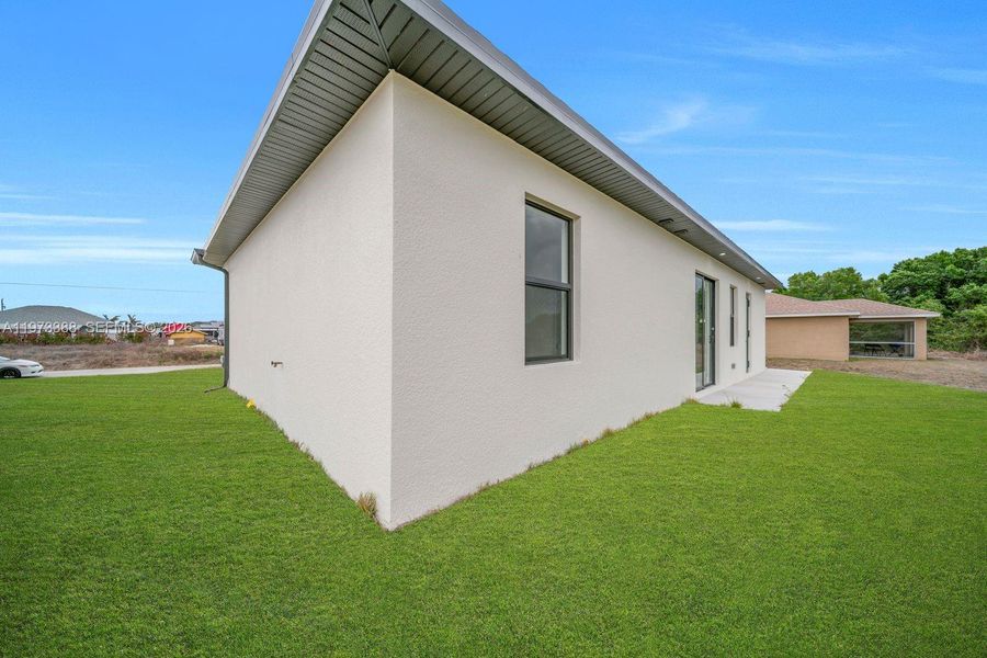 Exterior details and patio area of a home in , Lehigh Acres (Image 4).