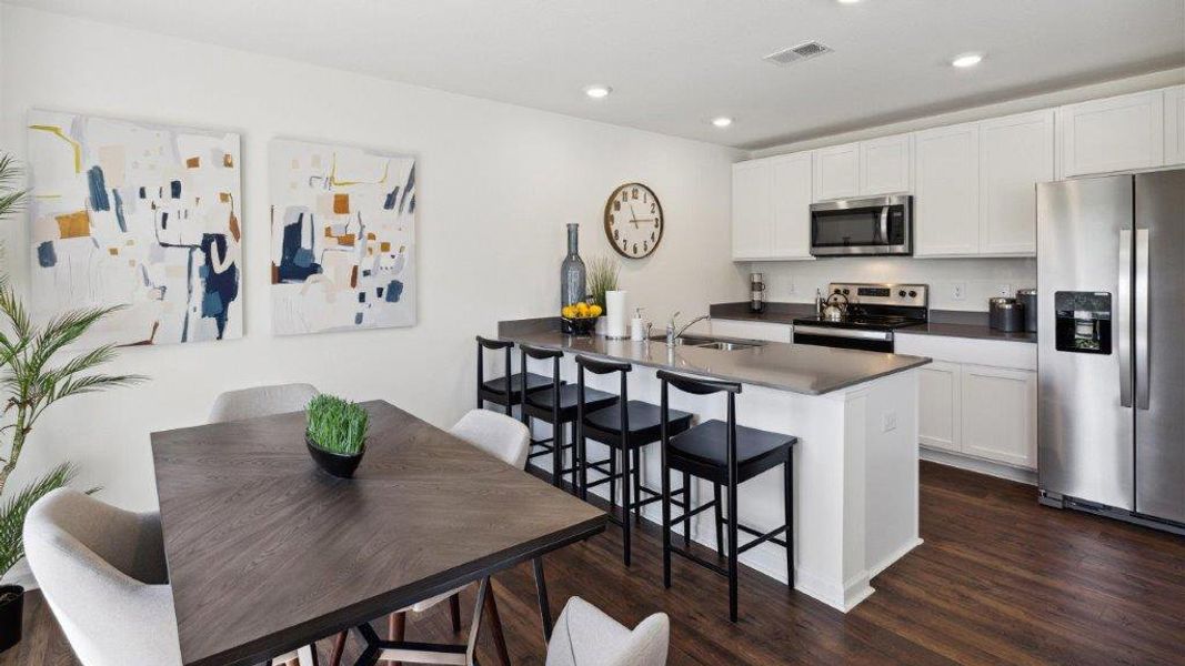 Representative furnished interior of a home built from the Altamont Townhome by D.R. Horton in Belcourt Landing, Cleveland (Image 7).