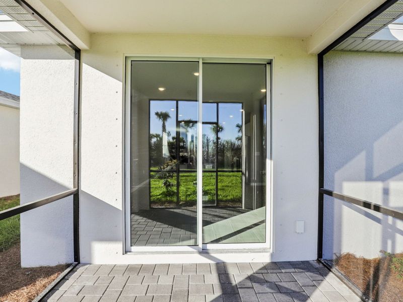 Exterior details and patio area of a home in Crescent Lakes - Premier Series, Punta Gorda (Image 2). Exterior details and patio area of a home in Crescent Lakes - Premier Series, Punta Gorda (Image 2).