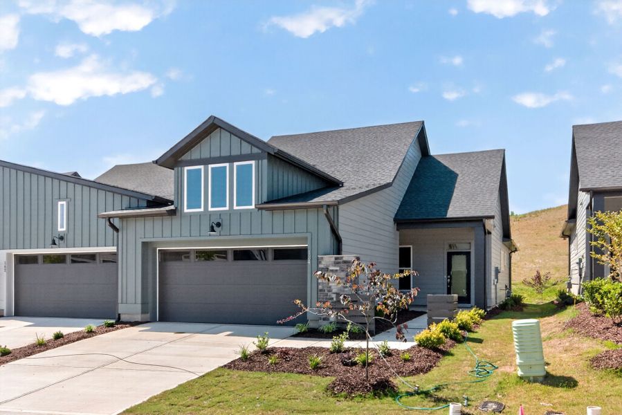 Front exterior of a new home in Encore at Chatham Park – Villa Series, Pittsboro, NC, highlighting curb appeal (Image 1). Front exterior of a new home in Encore at Chatham Park – Villa Series, Pittsboro, NC, highlighting curb appeal (Image 1).