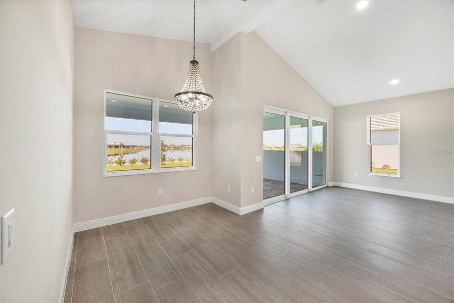 Dining area  and living overlooking lanai and lake