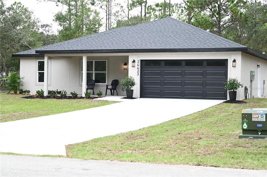 Front exterior of a new home in , Dunnellon, FL, highlighting curb appeal (Image 2).