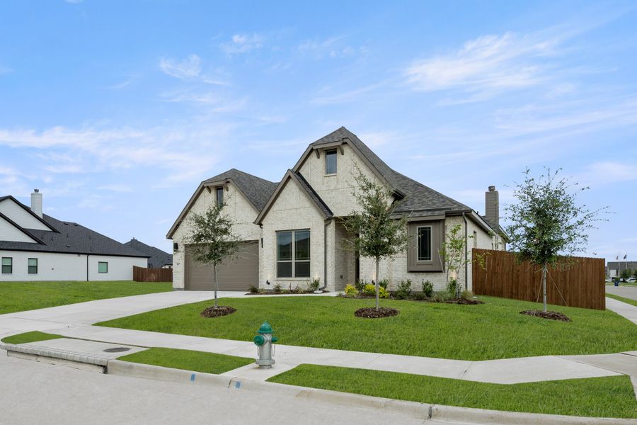 Front exterior of a new home in Ridgepoint, Midlothian, TX, highlighting curb appeal (Image 2).