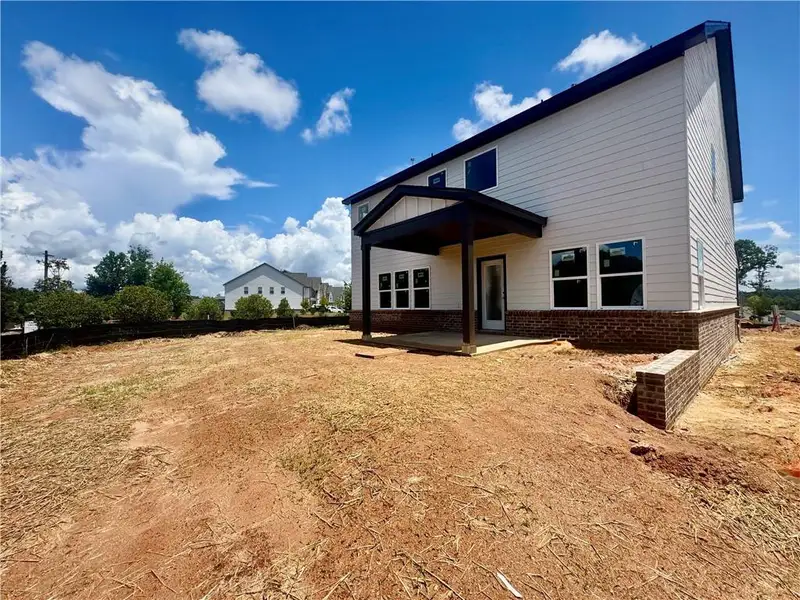 Exterior details and patio area of a home in Eastlyn Crossing, Flowery Branch (Image 3).