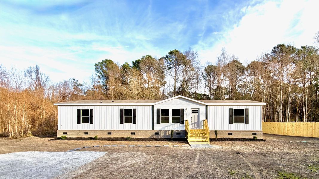Exterior details and patio area of a home in , Bonneau (Image 24).