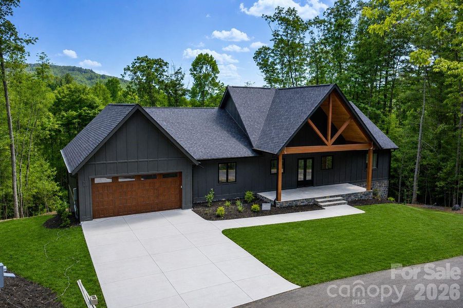 Front exterior of a new home in , Hendersonville, NC, highlighting curb appeal (Image 7).