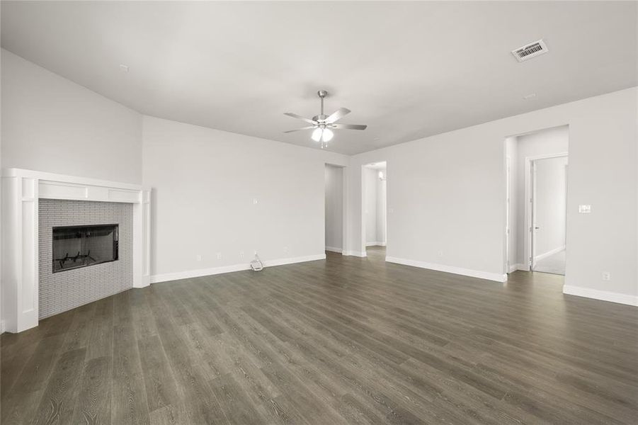 Wood Burning Fireplace anchors this open living room space Wood Burning Fireplace anchors this open living room space