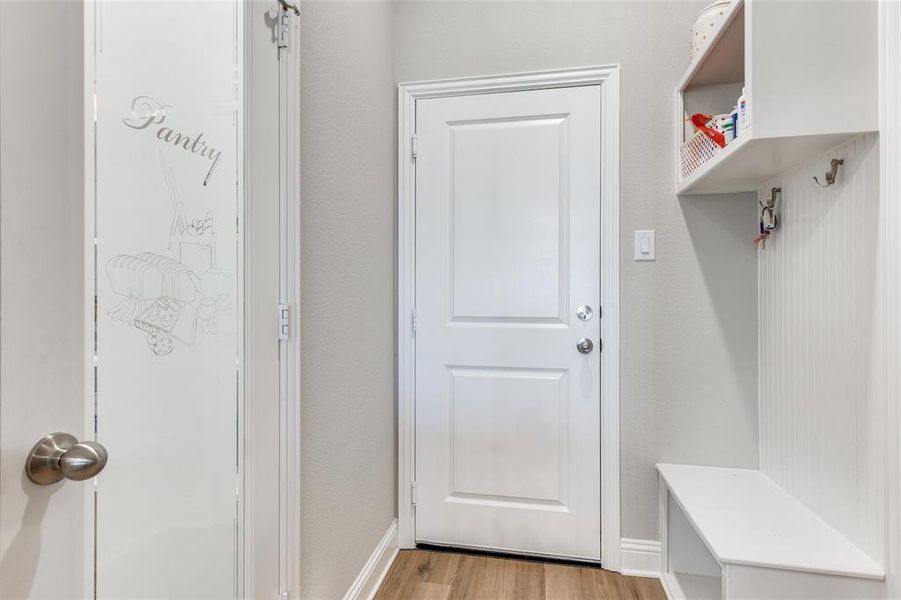 Mudroom with light wood finished floors and baseboards Mudroom with light wood finished floors and baseboards