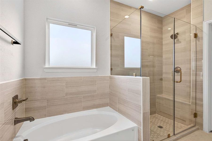 Full bathroom with a garden tub and a shower stall