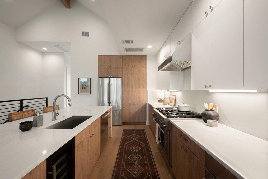 A well-appointed kitchen features sleek, integrated appliances and extensive counter space, perfect for culinary endeavors. A well-appointed kitchen features sleek, integrated appliances and extensive counter space, perfect for culinary endeavors.