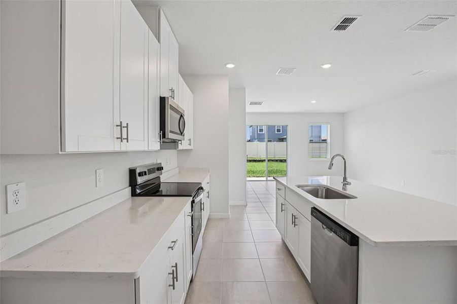 Furnished interior view inside a new home in Two Rivers - Premier Series, Zephyrhills (Image 5).