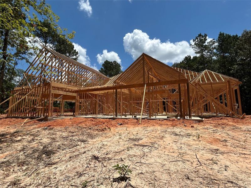 Rear patio view of the home in the frame stage