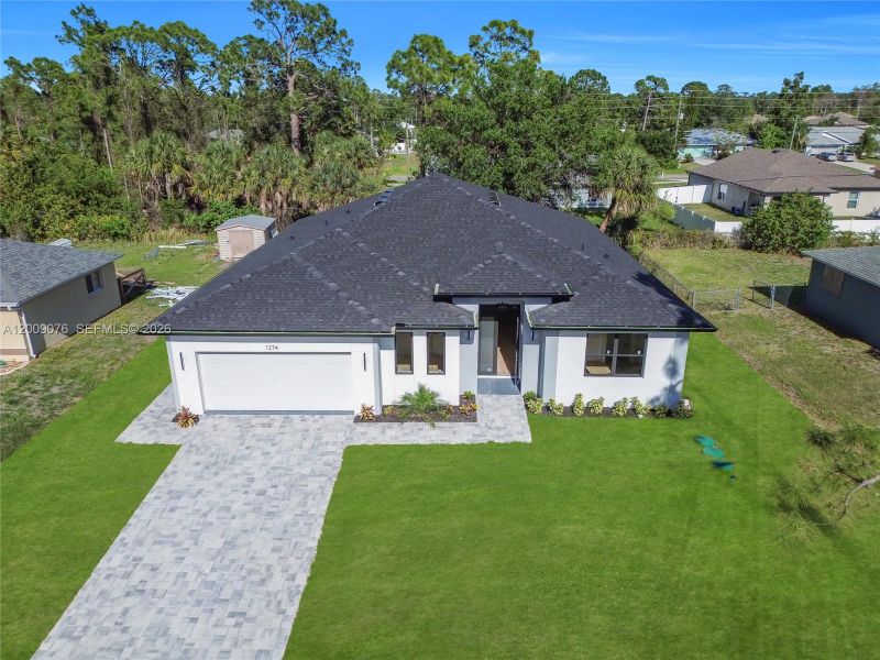 Front exterior of a new home in , North Port, FL, highlighting curb appeal (Image 20).