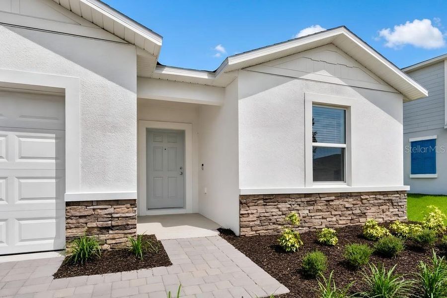Exterior details and patio area of a home in Waterstone, Groveland (Image 13).