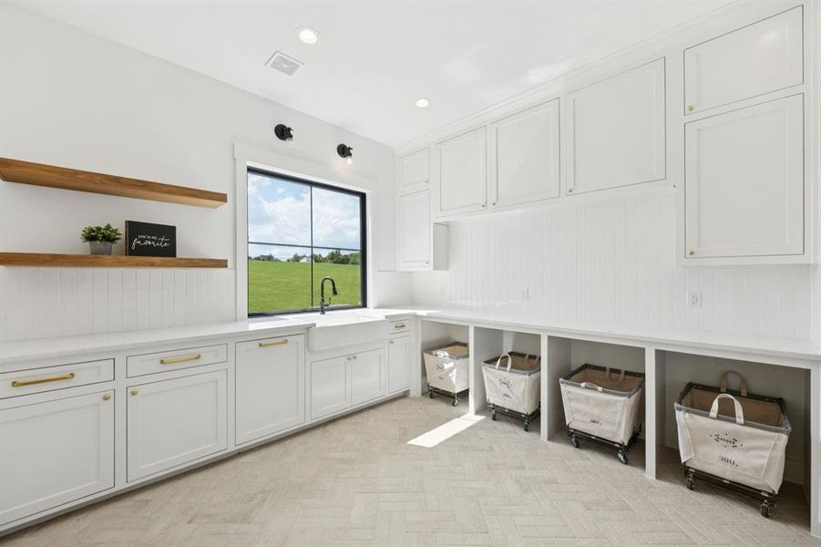 This is a dream laundry room! It accommodates two sets of stackable washer/dryers. Pictured are spaces for laundry baskets or perhaps a perfect place for pet beds! This is a dream laundry room! It accommodates two sets of stackable washer/dryers. Pictured are spaces for laundry baskets or perhaps a perfect place for pet beds!