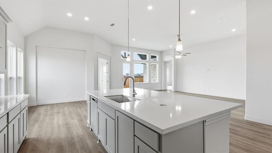 Kitchen island with an undermount sink and gooseneck faucet
