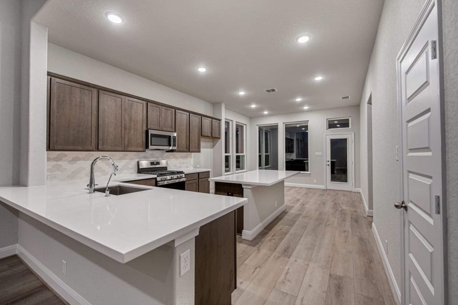 Representative furnished interior of a home built from the Portofino by Chesmar Homes in Legacy at Lake Dunlap, New Braunfels (Image 5). Representative furnished interior of a home built from the Portofino by Chesmar Homes in Legacy at Lake Dunlap, New Braunfels (Image 5).