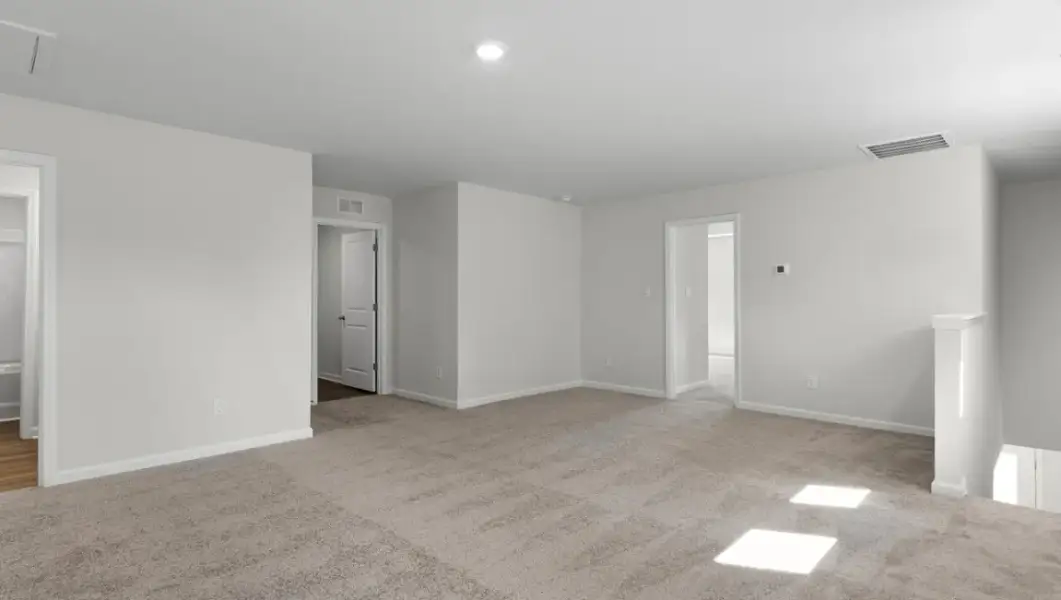 Spacious, unfurnished interior of a new home in The Highlands at Cedar Hill Landing, Navassa (Image 26).