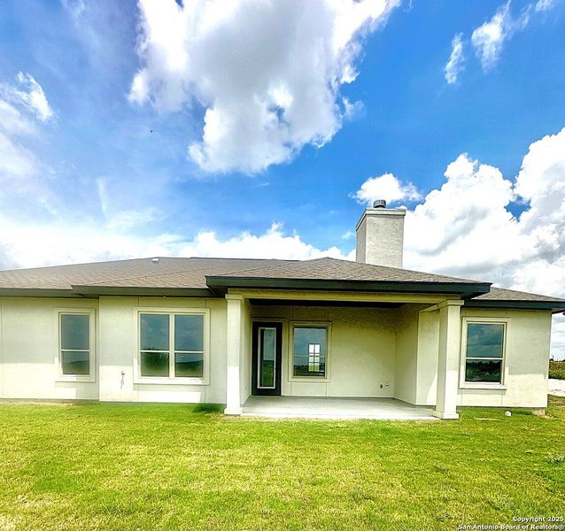 Front exterior of a new home in , La Vernia, TX, highlighting curb appeal (Image 27). Front exterior of a new home in , La Vernia, TX, highlighting curb appeal (Image 27).
