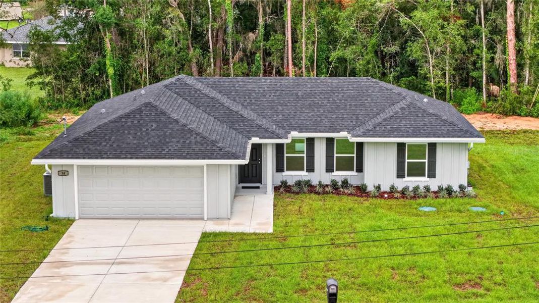 Front exterior of a new home in , Ocala, FL, highlighting curb appeal (Image 22). Front exterior of a new home in , Ocala, FL, highlighting curb appeal (Image 22).