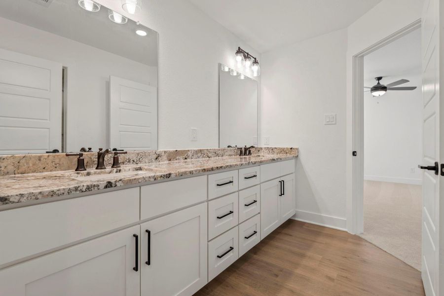 The upstairs bedrooms share a jack-and-jill bathroom. The upstairs bedrooms share a jack-and-jill bathroom.