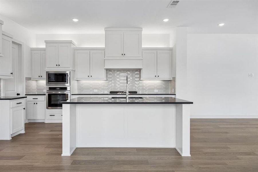 This spacious kitchen island with breakfast bar is the hub of your new dream kitchen!
