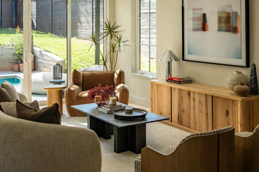 Sliding glass doors open directly to the sunny patio and backyard from this cozy space. Sliding glass doors open directly to the sunny patio and backyard from this cozy space.