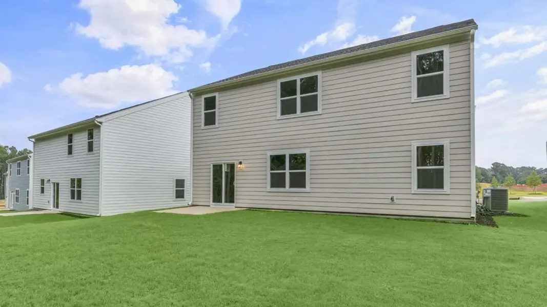 Exterior details and patio area of a home in Ridgewood Farms, Winterville (Image 3).