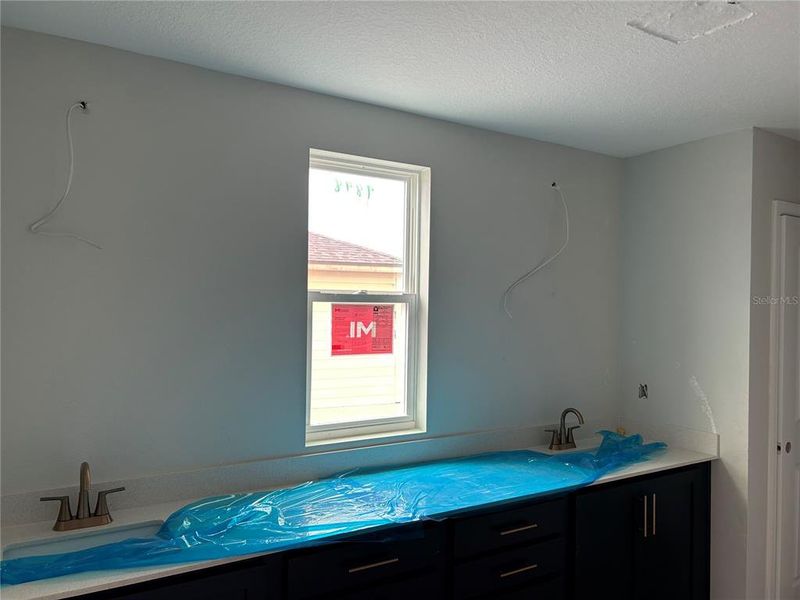 In-progress construction of a new home in Oakfield Trails Signature, Parrish, FL (Image 29).