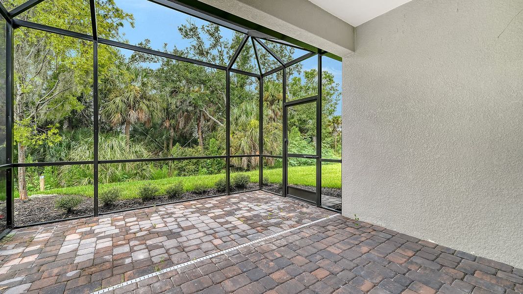 Exterior details and patio area of a home in Wildleaf Real Estate and Homes for Sale in Parrish, FL - Neal Communities, Parrish (Image 21). Exterior details and patio area of a home in Wildleaf Real Estate and Homes for Sale in Parrish, FL - Neal Communities, Parrish (Image 21).