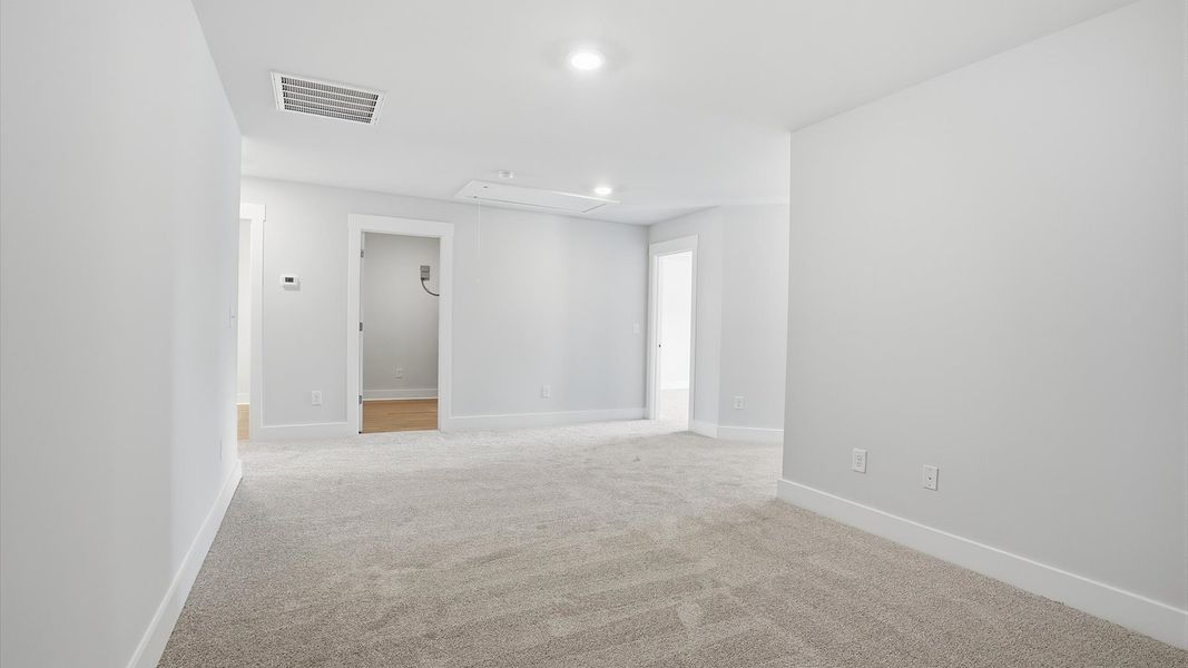 Accomplished upstairs loft with plush carpet and versatile functionality near Downtown Anderson