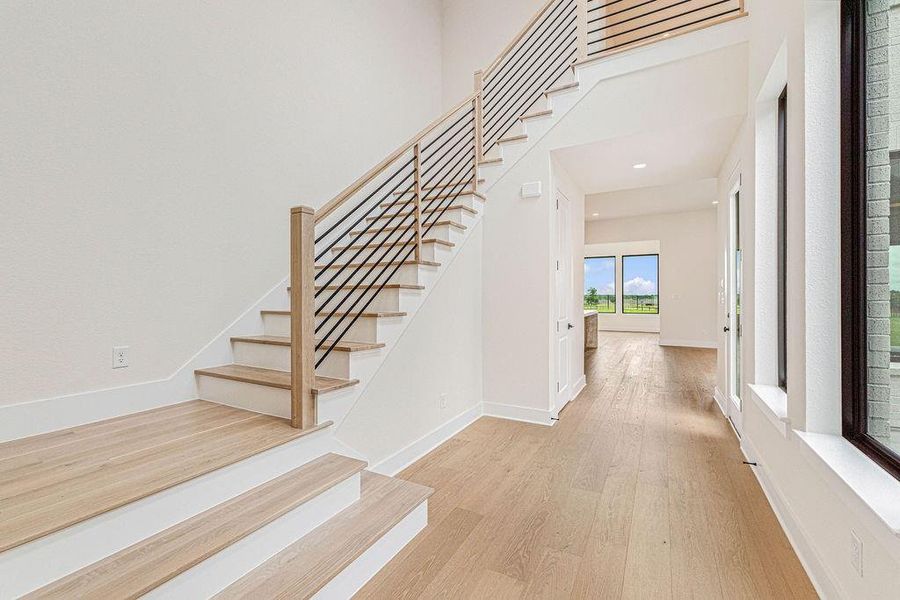 White oak staircase with horizontal balusters.