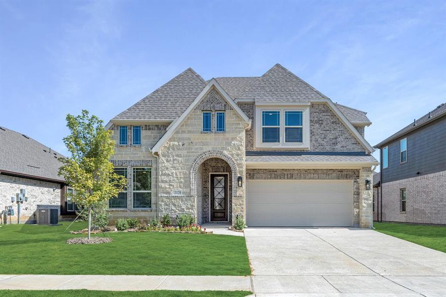 Front exterior of a new home in Woodstone, Providence Village, TX, highlighting curb appeal (Image 25). Front exterior of a new home in Woodstone, Providence Village, TX, highlighting curb appeal (Image 25).