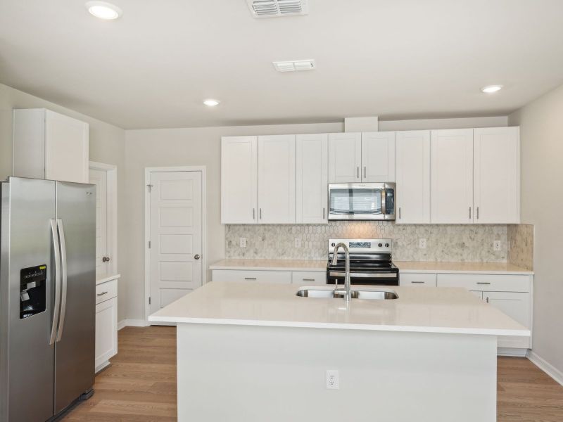 Furnished interior view inside a new home in Crescent Lakes - Premier Series, Punta Gorda (Image 5).